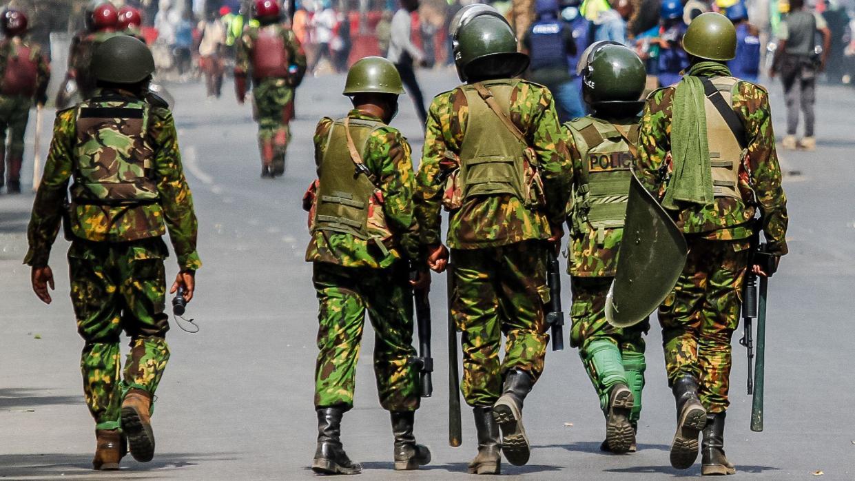 Kenyan police officers on patrol during anti-tax protests in Nairobi