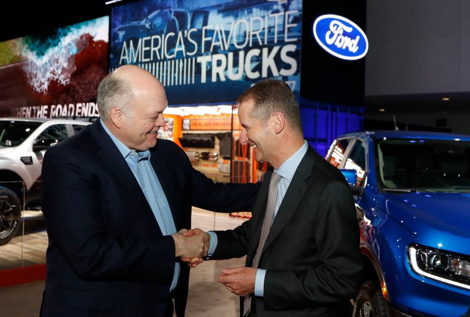 Ford Motor Co. President and CEO, Jim Hackett, left, meets with Dr. Herbert Diess, CEO of Volkswagen AG, Monday, Jan. 14, 2019, at the North American International Auto Show in Detroit.