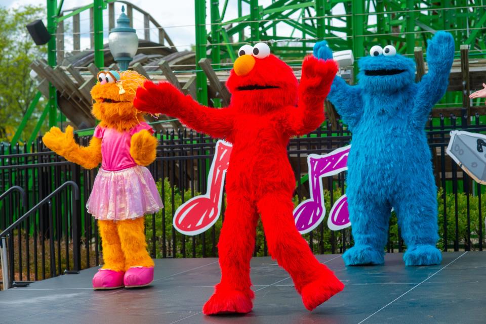 Elmo leads a dance onstage at Sesame Place in Langhorne.