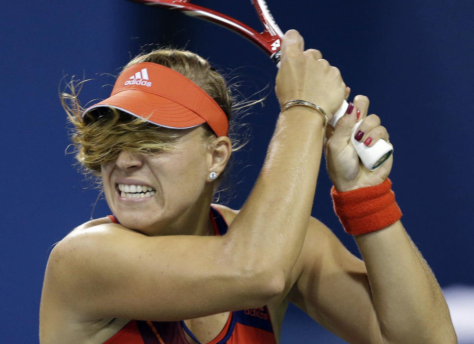 Angelique Kerber, of Germany, returns a shot to Czech Republic's Lucie Hradecka during the opening round of the U.S. Open tennis tournament Monday, Aug. 26, 2013, in New York. (AP Photo/Darron Cummings)