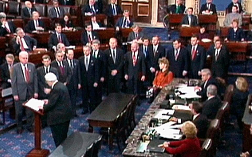 Henry Hyde reads the articles of impeachment against Bill Clinton to the Senate in 1999. The president was acquitted - AP