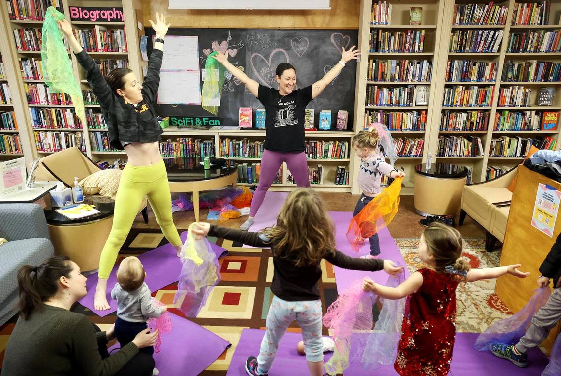 Brooke Blankenship, executive director and founder of Yogi Squad, leads a yoga class for toddlers at Fairmount Community Library on Tuesday, January 23, 2024. Yogi Squad is a nonprofit that provides yoga services throughout Fort Worth. The class features a literacy component to engage and adapt yoga techniques for children.