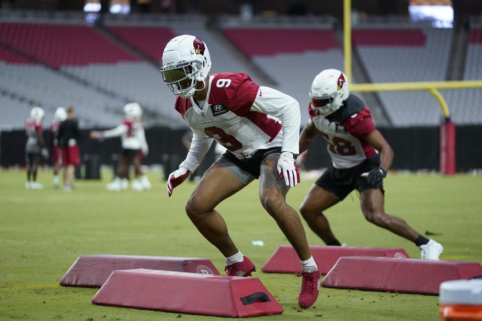 Arizona Cardinals linebacker Isaiah Simmons (9) and Cardinals middle linebacker Jordan Hicks, right, work on technique drills during NFL football training camp practice at State Farm Stadium, Friday, July 30, 2021, in Glendale, Ariz. (AP Photo/Ross D. Franklin)