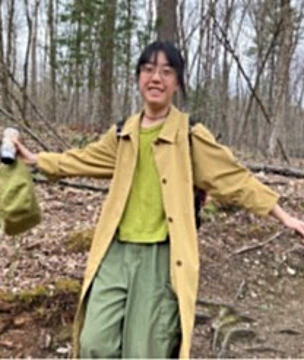 Kexin Cai in the woods