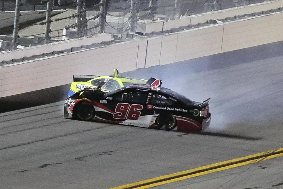 Daniel Suarez (96) and Ryan Blaney wreck as they come out of Turn 4 during the first of two NASCAR Daytona 500 qualifying auto races at Daytona International Speedway, Thursday, Feb. 13, 2020, in Daytona Beach, Fla. (AP Photo/David Graham)