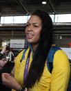 London 2012 Olympic athlete Liz Cambage arrives at Sydney Airport Wednesday August 15, 2012 . (AAP Image/Mick Tsikas) NO ARCHIVING