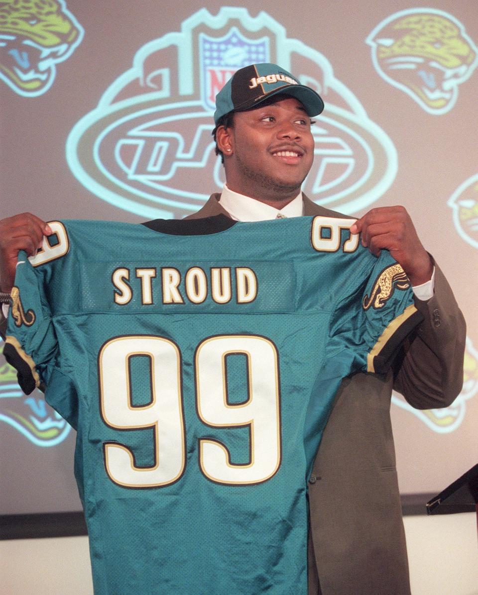 4/21/01--Will Dickey/staff--Marcus Stroud, defensive tackle from the University of Georgia, holds up his new Jaguars jersey after he was the first round draft pick of Jacksonville Saturday. 