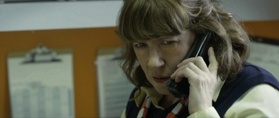 Ann Dowd talking on the phone.