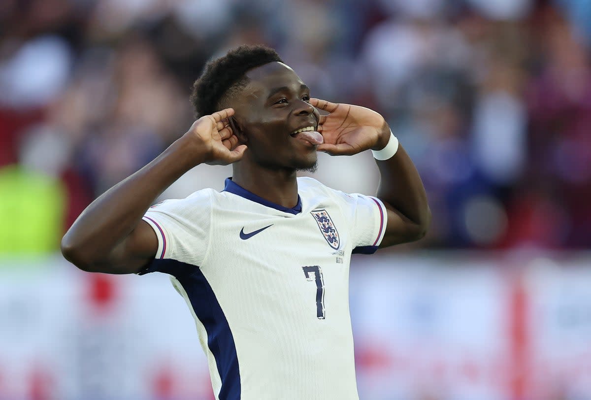 Bukayo Saka celebrates scoring England's third penalty in the shoot-out in the Euro 2024 quarter-final against Switzerland at Dusseldorf Arena on July 6 (Richard Pelham/Getty Images)