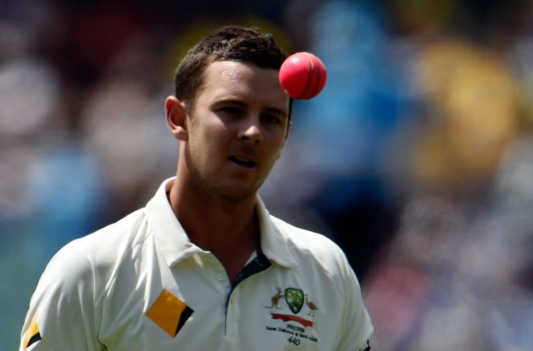 Australia's paceman Josh Hazlewood tosses a pink ball as he gets ready to bowl during a Test match in Adelaide, in November 2015