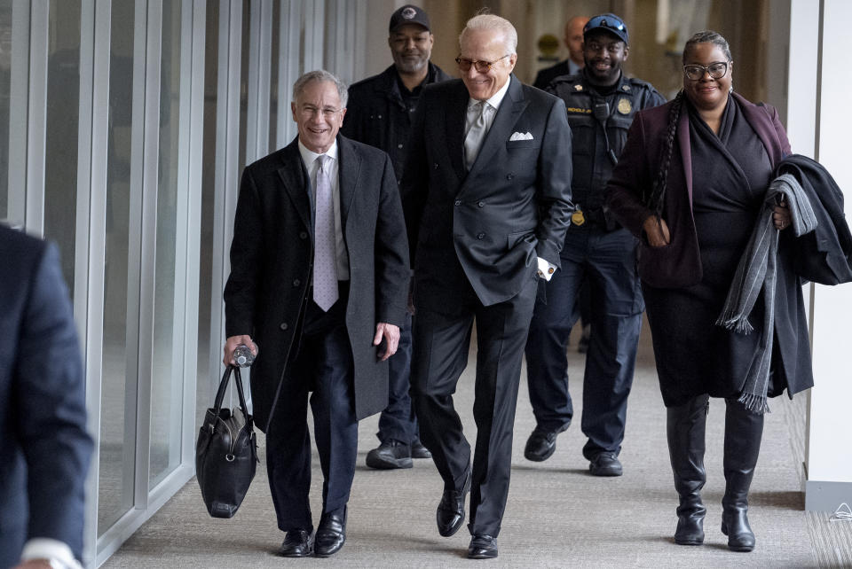 James Biden, brother of President Joe Biden, accompanied by Attorney Paul Fishman, left, arrives for a private interview with House Republicans at Thomas P. O'Neill House Office Building on Capitol Hill in Washington, Wednesday, Feb. 21, 2024. (AP Photo/Andrew Harnik)