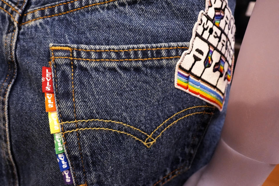 A jean skirt is displayed with a 2024 Levi's Pride collection patch and tabs at Levi's Store in downtown Chicago, Monday, June 10, 2024. Many big retailers, including Levi's, Target, Old Navy and Urban Outfitters, have put out Pride collections for years. (AP Photo/Nam Y. Huh)