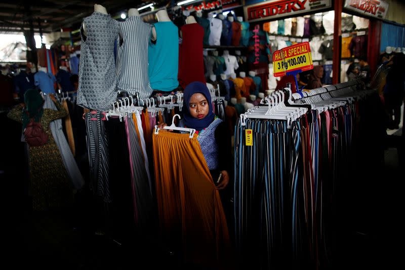 A vendor waits for customers at Tanah Abang textile market in Jakarta