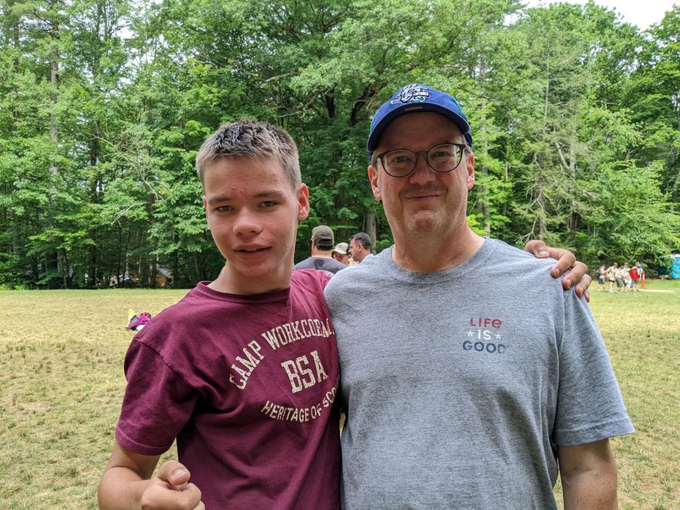 Chris Kelly with his son, Thomas, at Boy Scout Camp in the summer of 2022. Kelly worries a government default could halt the disability payments his son receives.