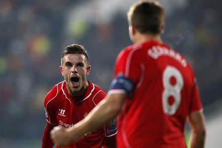 Jordan Henderson (L) of Liverpool celebrates with team-mate Steven Gerrard after scoring against Ludogorets during their Champions League Group B soccer match at Vassil Levski stadium in Sofia, November 26, 2014. REUTERS/Stoyan Nenov