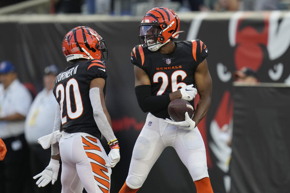 Cincinnati Bengals safety Tycen Anderson (26) celebrates his interception for a touchdown with cornerback DJ Turner II (20) during the first half of a preseason NFL football game against the Green Bay Packers on Friday, Aug. 11, 2023, in Cincinnati. (AP Photo/Michael Conroy)