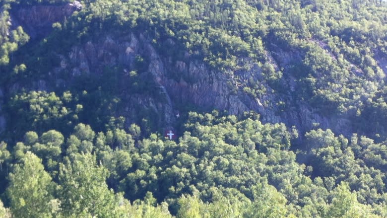 White crosses on Sugarloaf mountain repainted by Campbellton woman