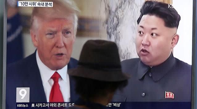 A man in South Korea watches a television screen showing U.S. President Donald Trump, left, and North Korean leader Kim Jong Un. Photo: AP