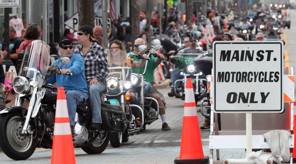 Riders make the right turn onto Atlantic Avenue after a cruise down Main Street on Friday's opening day of Bike Week 2024 in Daytona Beach. The 10-day event is expected to attract 300,000-400,000 motorcycle fans to a region that stretches beyond Daytona Beach throughout Central Florida.