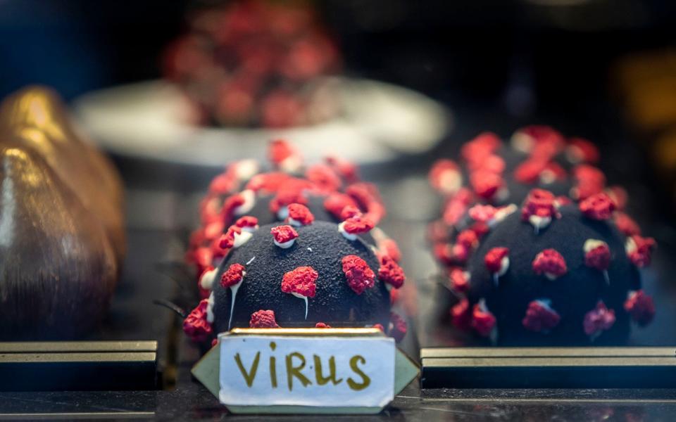 A dessert in the shape of a coronavirus placed in a window of a coffee shop in Prague - Gabriel Kuchta/Getty Images