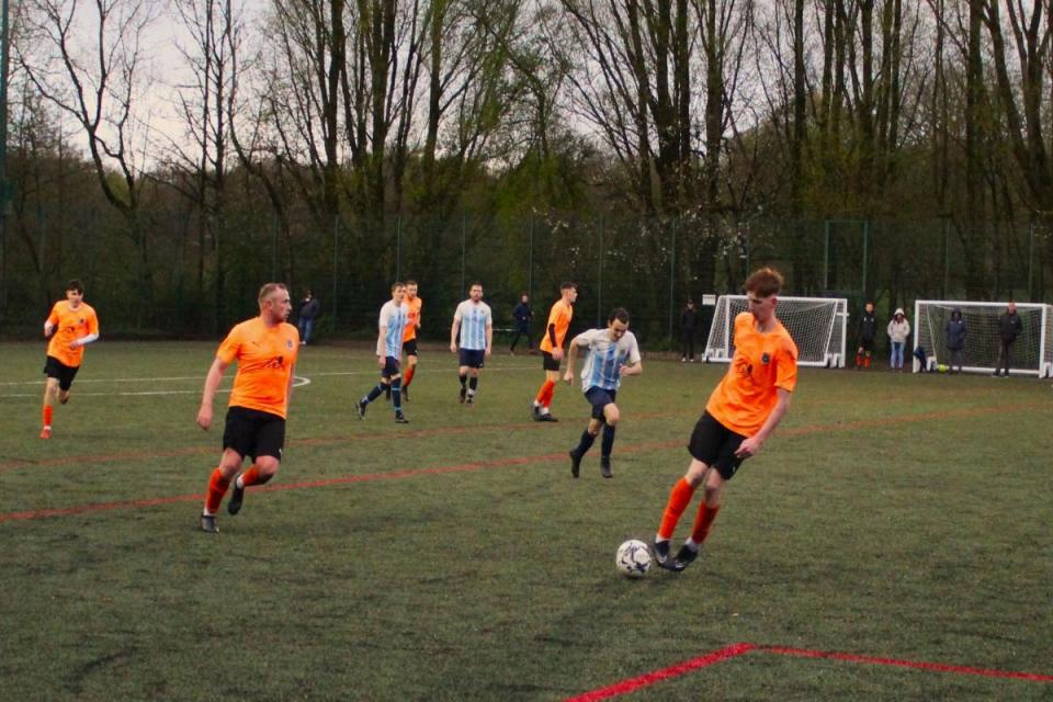 Pennington’s Jordan Barker on the ball against North Walkden. Picture by Ian Templeman