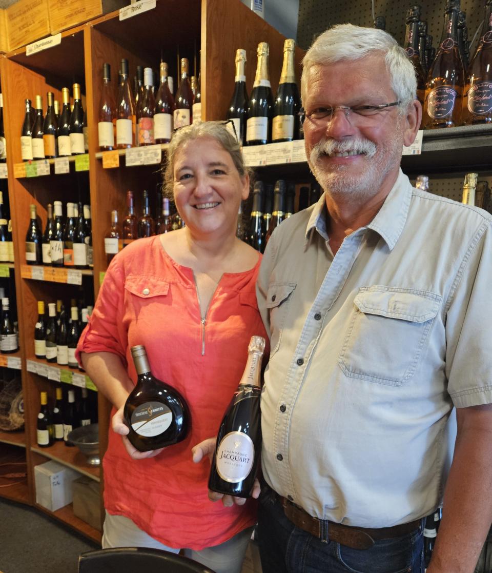 Frederick and Claudia Mursch, the Wine House’s owners, offer facts on the history of wines to obscure facts about the shape of wine bottles.