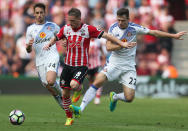 Football Soccer Britain - Southampton v Sunderland - Premier League - St Mary's Stadium - 27/8/16 Southampton's Steven Davis in action with Sunderland's Donald Love and Adnan Januzaj Action Images via Reuters / Matthew Childs Livepic EDITORIAL USE ONLY. No use with unauthorized audio, video, data, fixture lists, club/league logos or "live" services. Online in-match use limited to 45 images, no video emulation. No use in betting, games or single club/league/player publications. Please contact your account representative for further details.