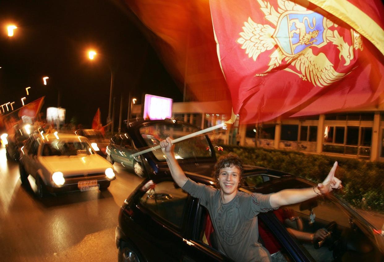 <span class="caption">Celebrating Montenegrin independence on May 21, 2006. </span> <span class="attribution"><a class="link " href="https://www.gettyimages.com/detail/news-photo/podgorica-serbia-and-montenegro-a-supporter-of-montenegrin-news-photo/71003303?adppopup=true" rel="nofollow noopener" target="_blank" data-ylk="slk:Diminar Dilkoff/AFP via Getty Images;elm:context_link;itc:0;sec:content-canvas">Diminar Dilkoff/AFP via Getty Images</a></span>