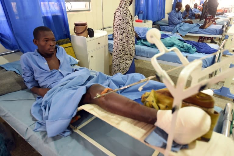 An man, injured in a Boko Haram attack, lies on his bed in a hospital ward in Maiduguri, capital of northeast Nigerian Borno State