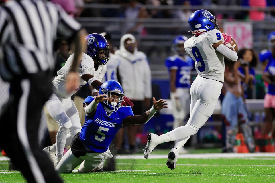 Trinity Christian's Kyle Boylston (9) grabs an interception against Riverside in an October 2022 game.