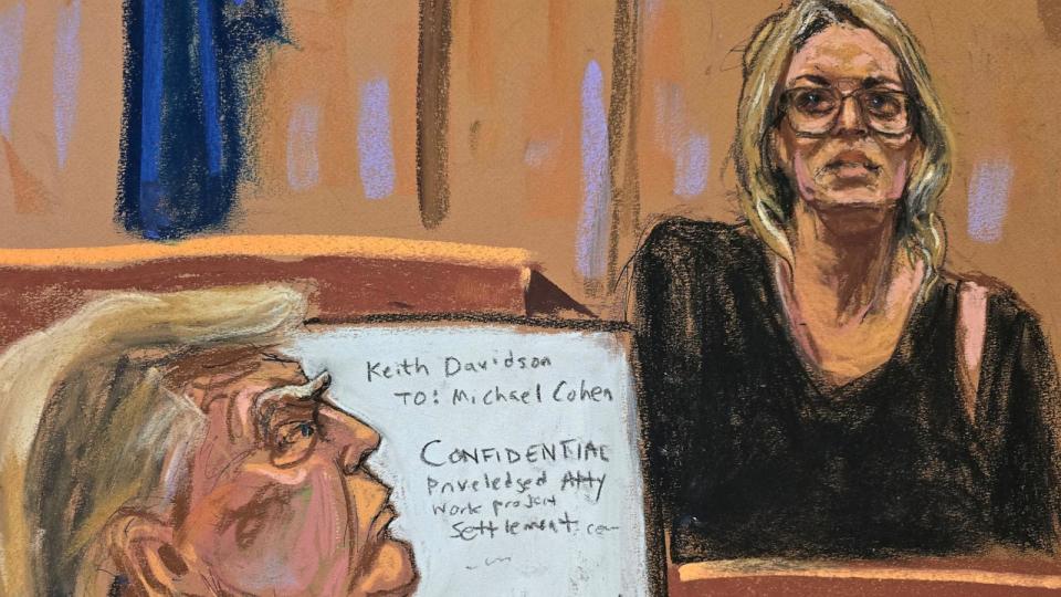 PHOTO: Former President Donald Trump watches as Stormy Daniels is questioned in Manhattan state court in New York City, May 7, 2024, in this courtroom sketch.  (Jane Rosenberg/Reuters)
