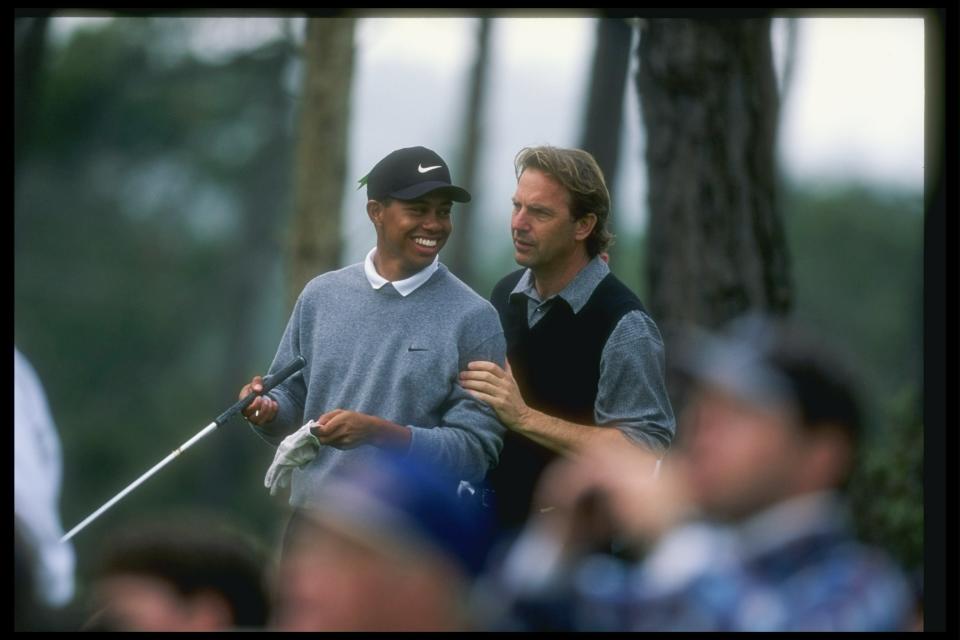 31 Jan 1997: Tiger Woods and actor Kevin Costner confer during the AT&T National Pro-Am at the Poppy Hills Golf Course in Pebble Beach, California.