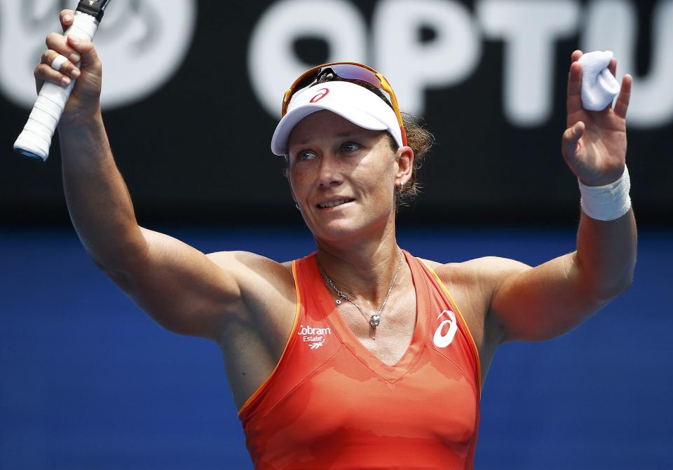 Stosur of Australia celebrates defeating Niculescu of Romania to win their women's singles match at the Australian Open 2015 tennis tournament in Melbourne