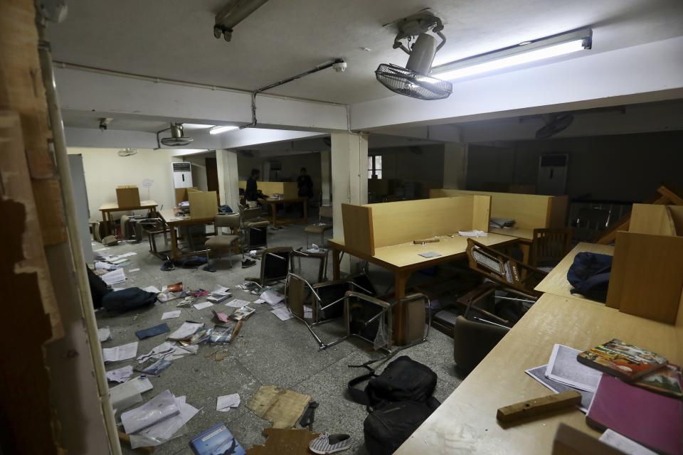 The library of the Jamia Millia Islamia University that was stormed by police Sunday in New Delhi, India, Monday, Dec.16, 2019. Police on Sunday fired tear-gas and struck with batons students who protested against a new law that will give citizenship to non-Muslims fleeing religious persecution from several neighboring countries. (AP Photo/Manish Swarup)