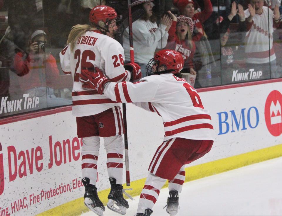 Wisconsin's Casey O'Brien (26) jumps for joy as Lacey Eden (6) closes in for a hug after O'Brien scored during the third period against Ohio State Saturday February 24, 2024 at La Bahn Arena in Madison, Wisconsin.