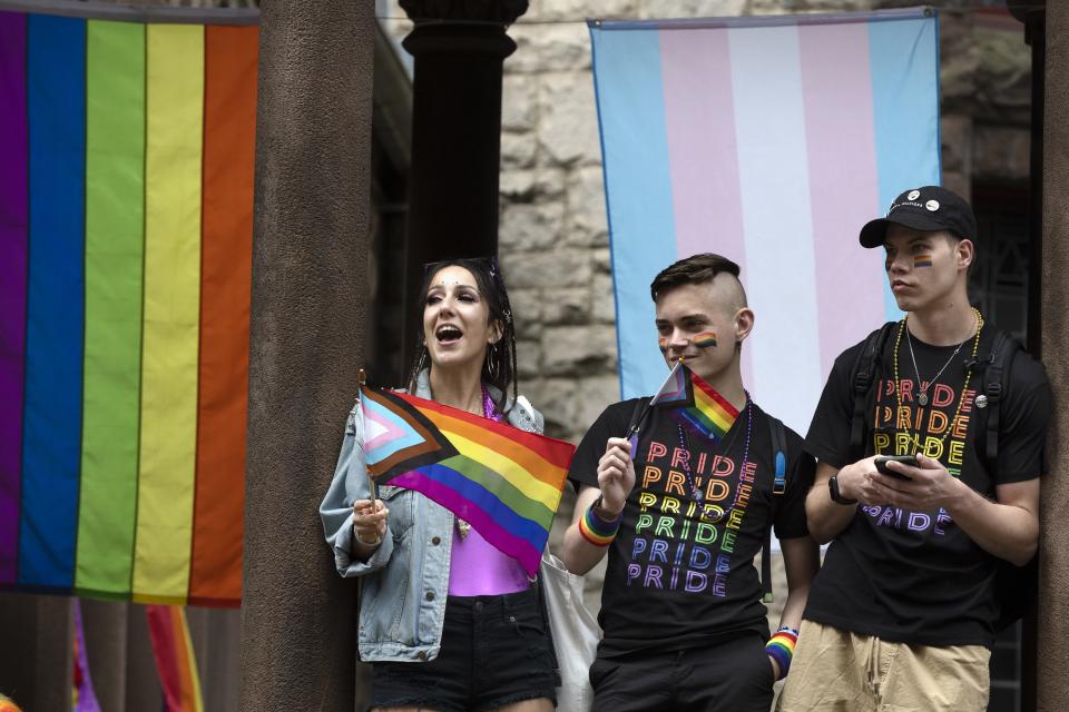 Spectators watch along the Pride parade route, Saturday, June 10, 2023, in Boston. The biggest Pride parade in New England returned on Saturday after a three-year hiatus, with a fresh focus on social justice and inclusion rather than corporate backing. (AP Photo/Michael Dwyer)
