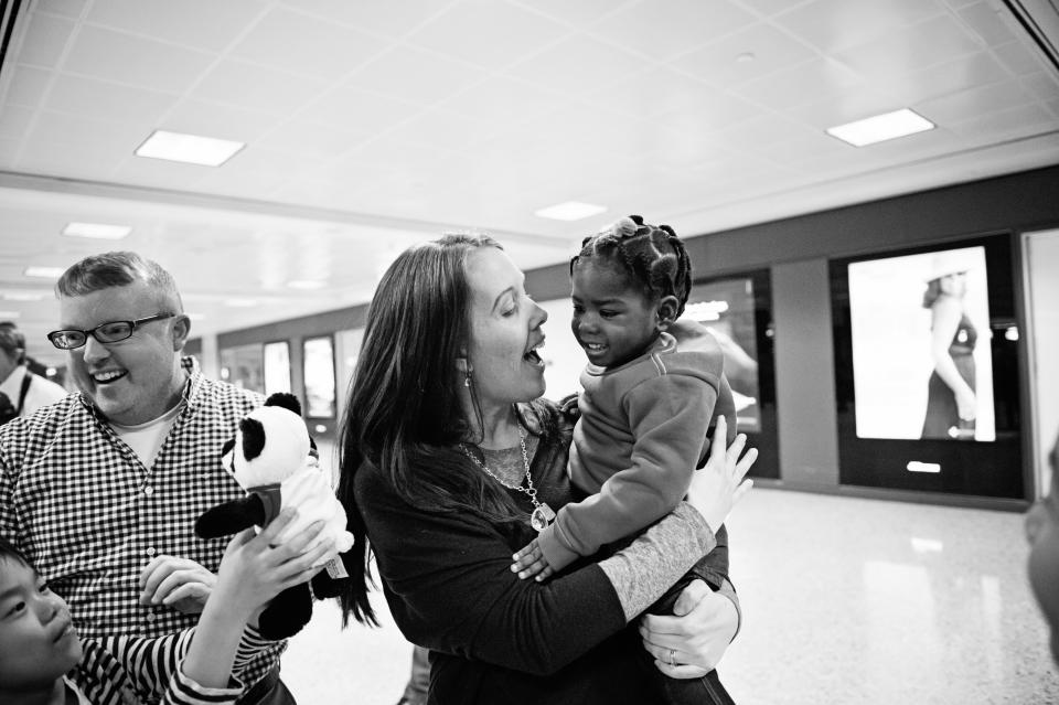 "Olivia, adopted from Congo, meets her family." -- Sandra Eminger