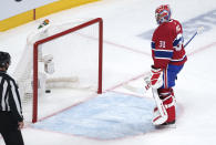 Montreal Canadiens goaltender Carey Price looks back at the puck in the net following a goal by Tampa Bay Lightning's Tyler Johnson during the third period of Game 3 of the NHL hockey Stanley Cup Final, Friday, July 2, 2021, in Montreal. (Paul Chiasson/The Canadian Press via AP)