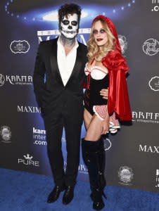 Maksim Chmerkovskiy (left) and wife Peta Murgatroyd at the Maxim Halloween Party