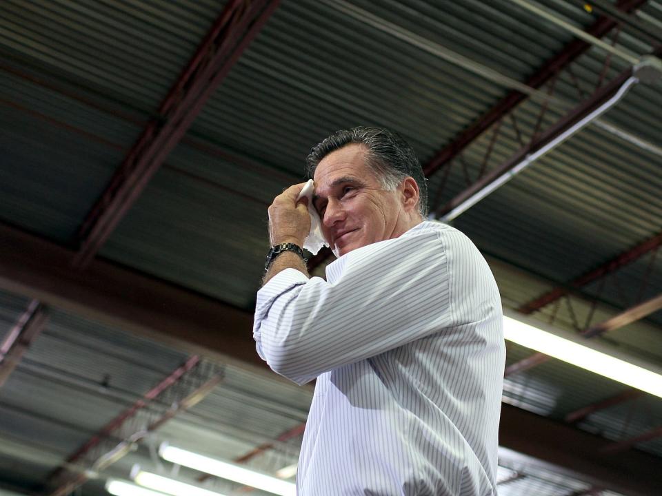 Mitt Romney wipes sweat from his face in 2012.