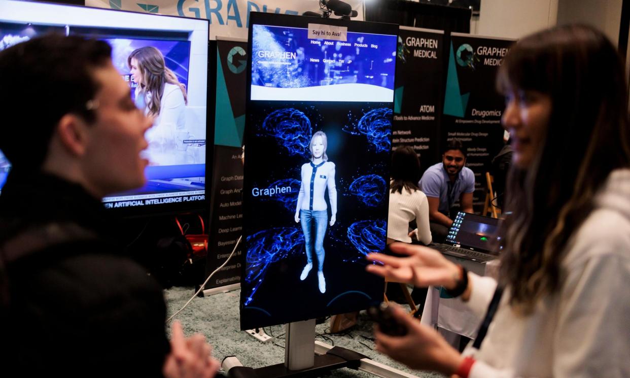 <span>A screen showing an interactive computer avatar powered by AI, at a summit in New York in 2022.</span><span>Photograph: Justin Lane/EPA</span>