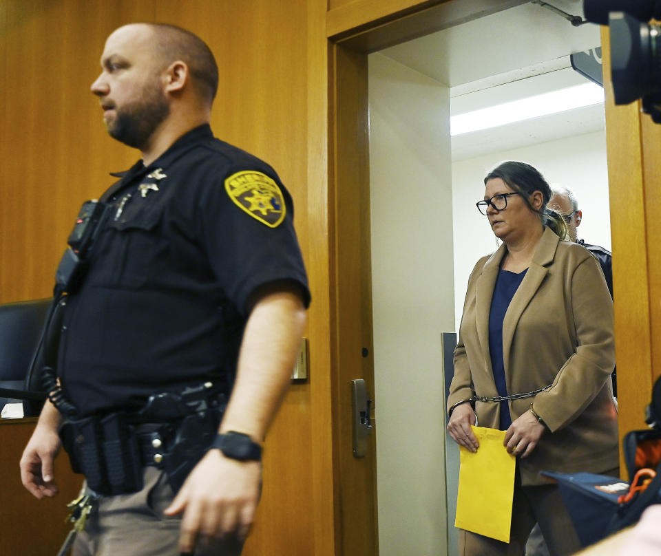 Defendant Jennifer Crumbley enters the courtroom for trial at Oakland County Courthouse, Tuesday, Jan. 30, 2024, in Pontiac, Mich. Crumbley, 45, is charged with involuntary manslaughter. Prosecutors say she and her husband were grossly negligent and could have prevented the four deaths if they had tended to their son’s mental health. They’re also accused of making a gun accessible at home. (Clarence Tabb Jr./Detroit News via AP)