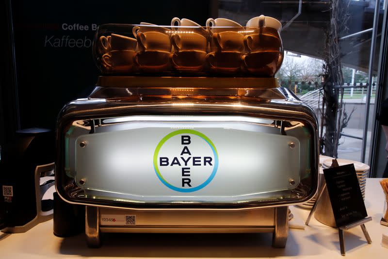 The logo of Bayer AG is seen at an espresso machine before German drugmaker's annual results news conference in Leverkusen