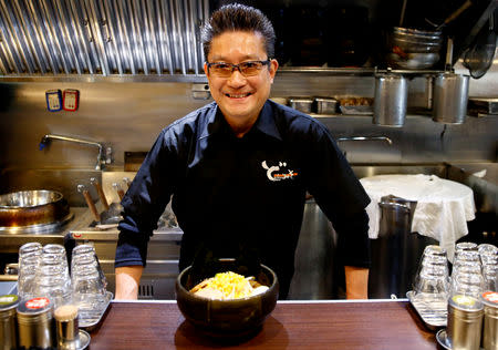 Kenji Saito poses at his ramen noodle shop in Tokyo, Japan April 12, 2019. Picture taken on April 12, 2019. REUTERS/Kim Kyung-hoon