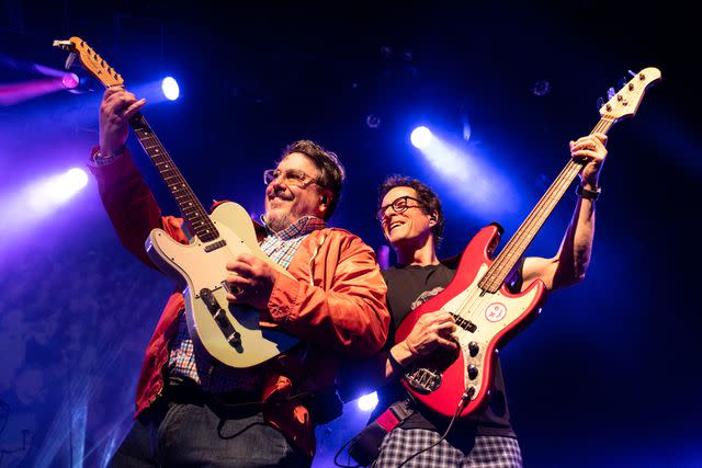<p>Dana Jacobs/Getty </p> John Flansburgh and Danny Weinkauf of They Might Be Giants perform in 2023.