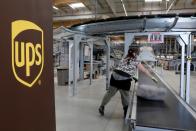 FILE PHOTO: An United Parcel Service employee works at the new package sorting and delivery UPS hub in Corbeil-Essonnes and Evry