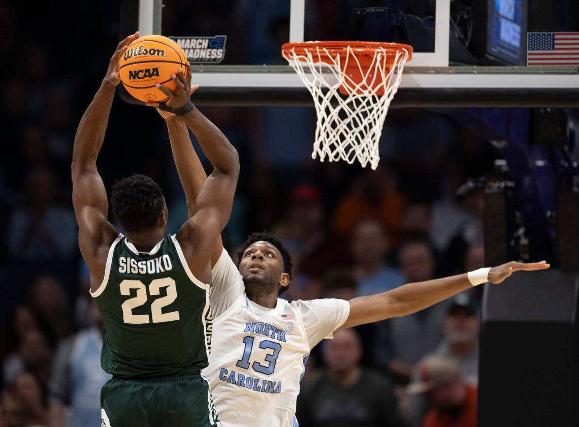 North Carolina’s Jalen Washington (13) defends Michigan State’s Mady Sissoko (22) during the first half on Saturday, March 23, 2024, during the second round of the NCAA Tournament at Spectrum Center in Charlotte, N.C.