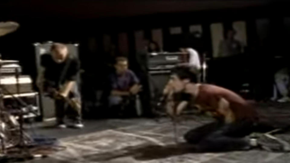 Fugazi on stage playing