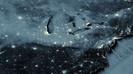 Snow cover and clouds from the Great Lakes to the Mid-Atlantic are seen in an image from NASA's Suomi NPP satellite taken at 02:45 EST (07:45 GMT) January 8, 2015. REUTERS/NASA/Handout via Reuters