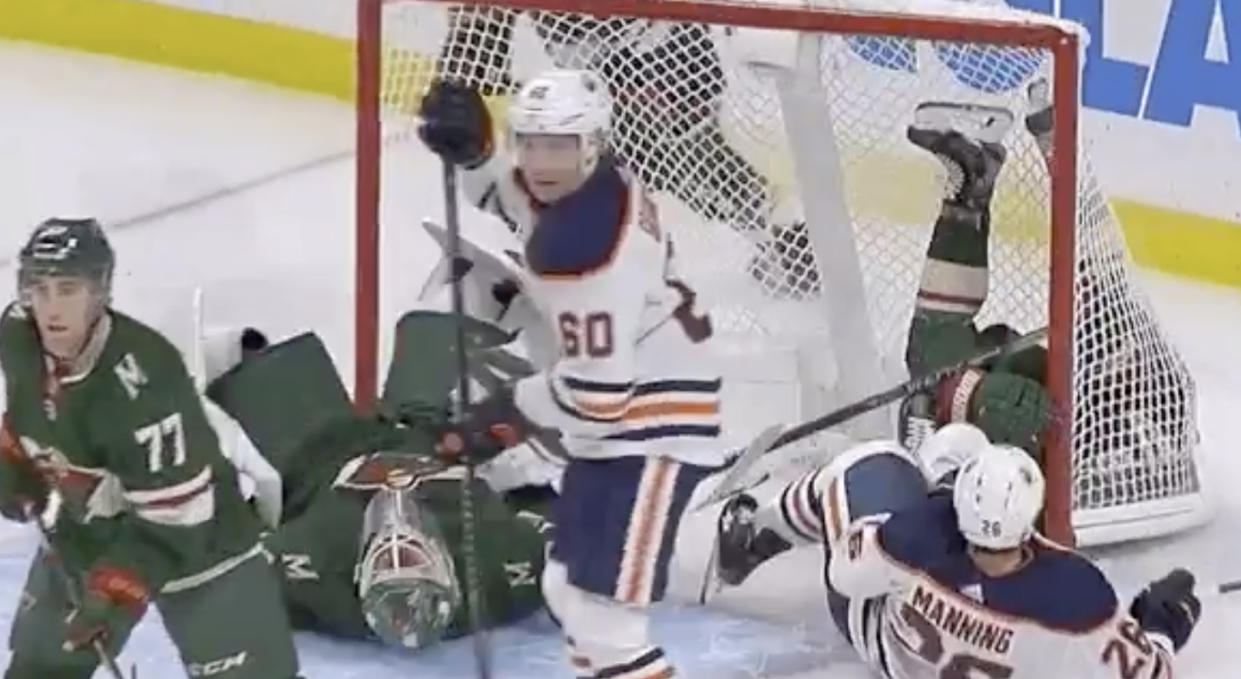 Minnesota goaltender Devan Dubnyk was the true victim after teammate Ryan Donato and Brandon Manning of the Edmonton Oilers got tied up and slid into him on Tuesday night. (Twitter//@hockeywildernes)